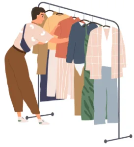 Une femme choisit des vêtements sur un portant, potentiellement pour vérifier la présence de punaises de lit.